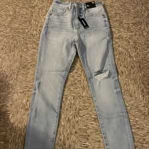 Express 00S ripped left leg denim